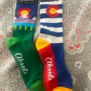 Two pairs of Colorado themed men’s socks. Fit men shoe sized 6-13.